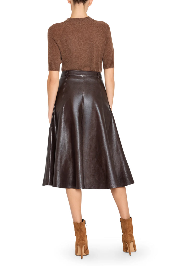 Faux leather midi skirt with streamlined silhouette and clean waistband, back view on model.