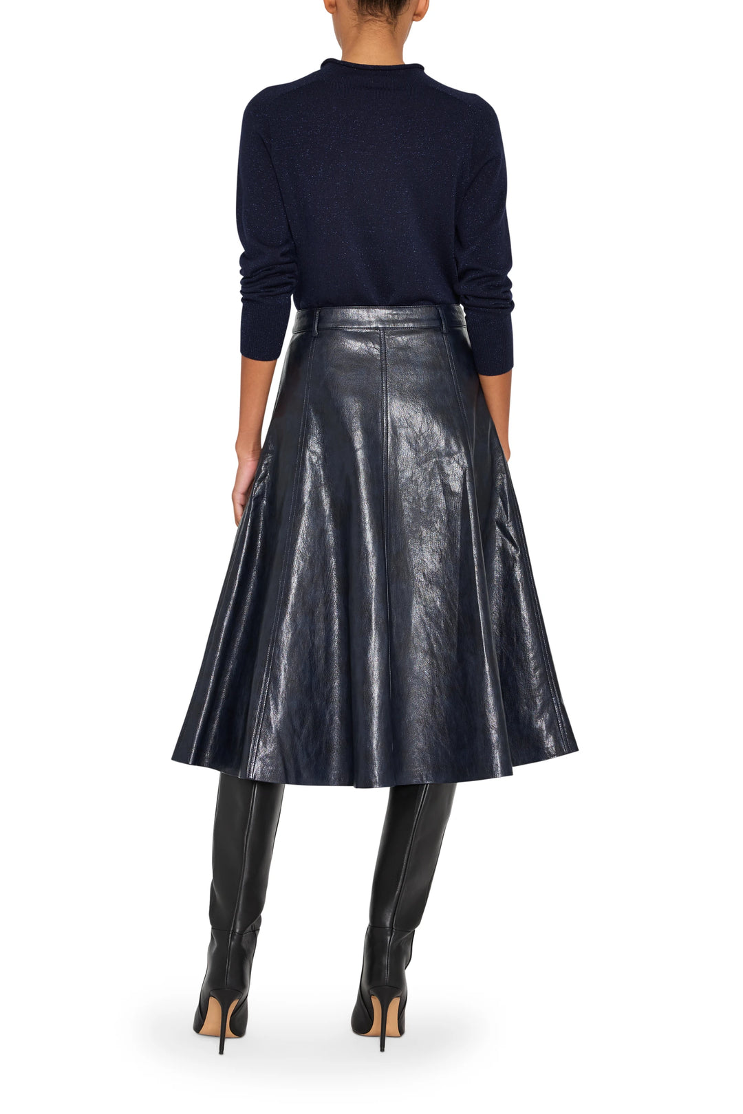 Vegan leather skirt with straight silhouette, clean construction, midi length, back view on model.