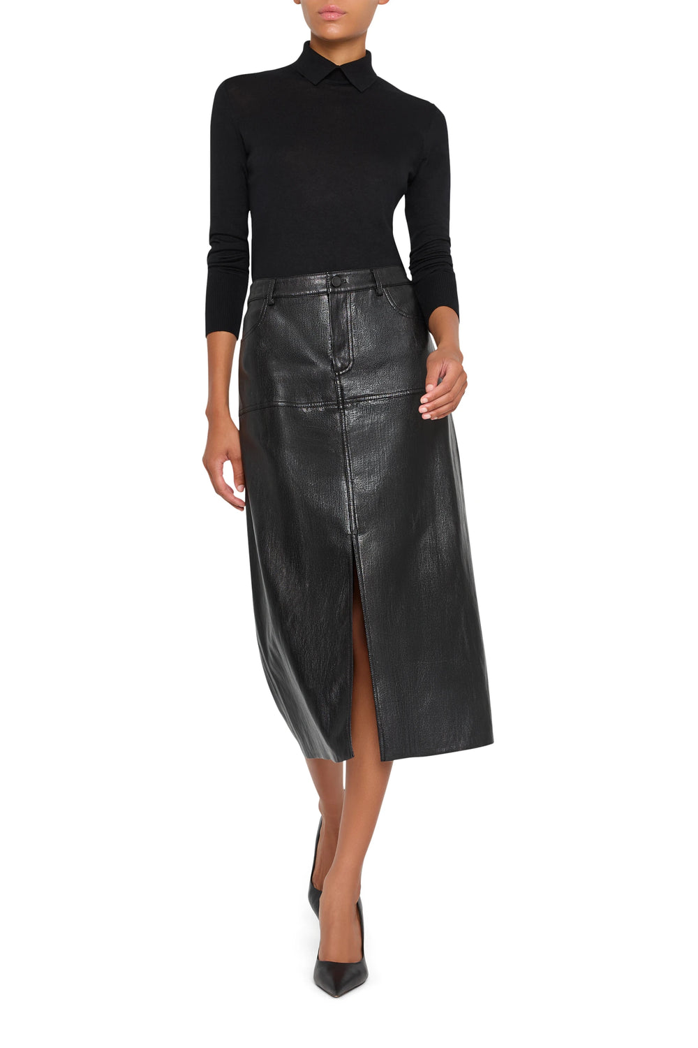 Vegan leather pencil skirt with center slit, tailored fit, clean lines, midi length. Front view on model.
