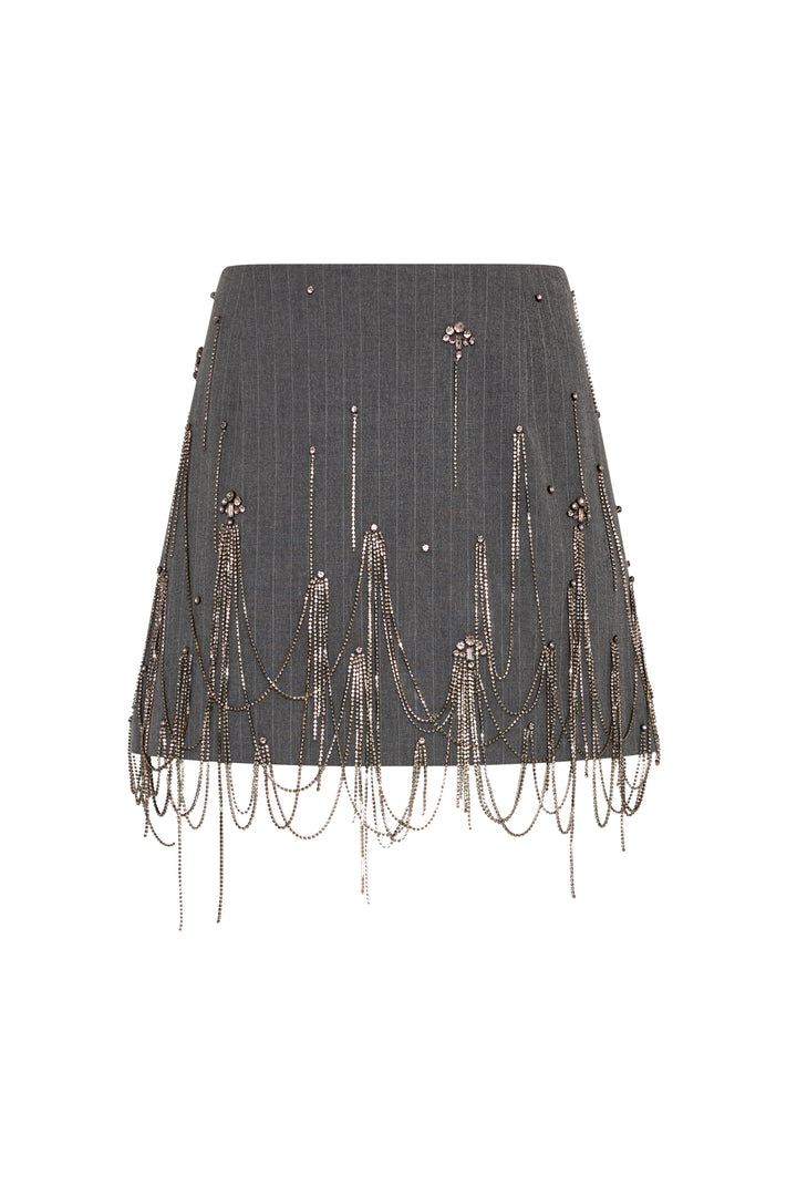 Mini skirt with pinstripes, embellished with dangling gold chains and crystals, fitted silhouette; front view on white.