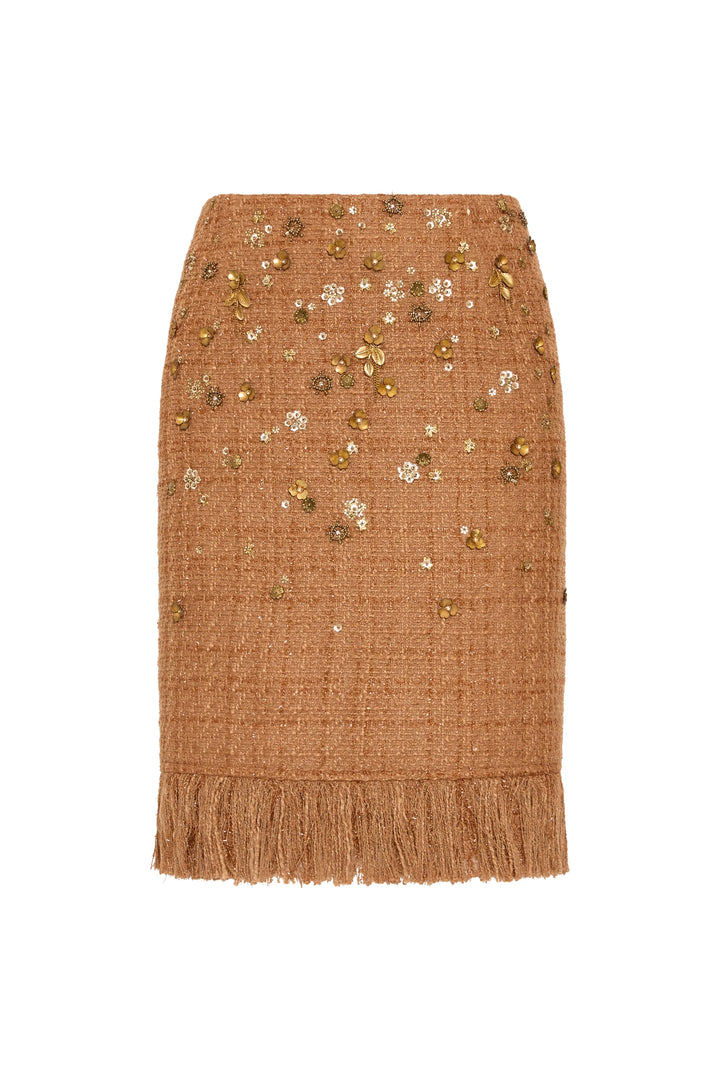 A-line brown tweed skirt, fringe hem, floral embellishments, textured fabric; front view on white.