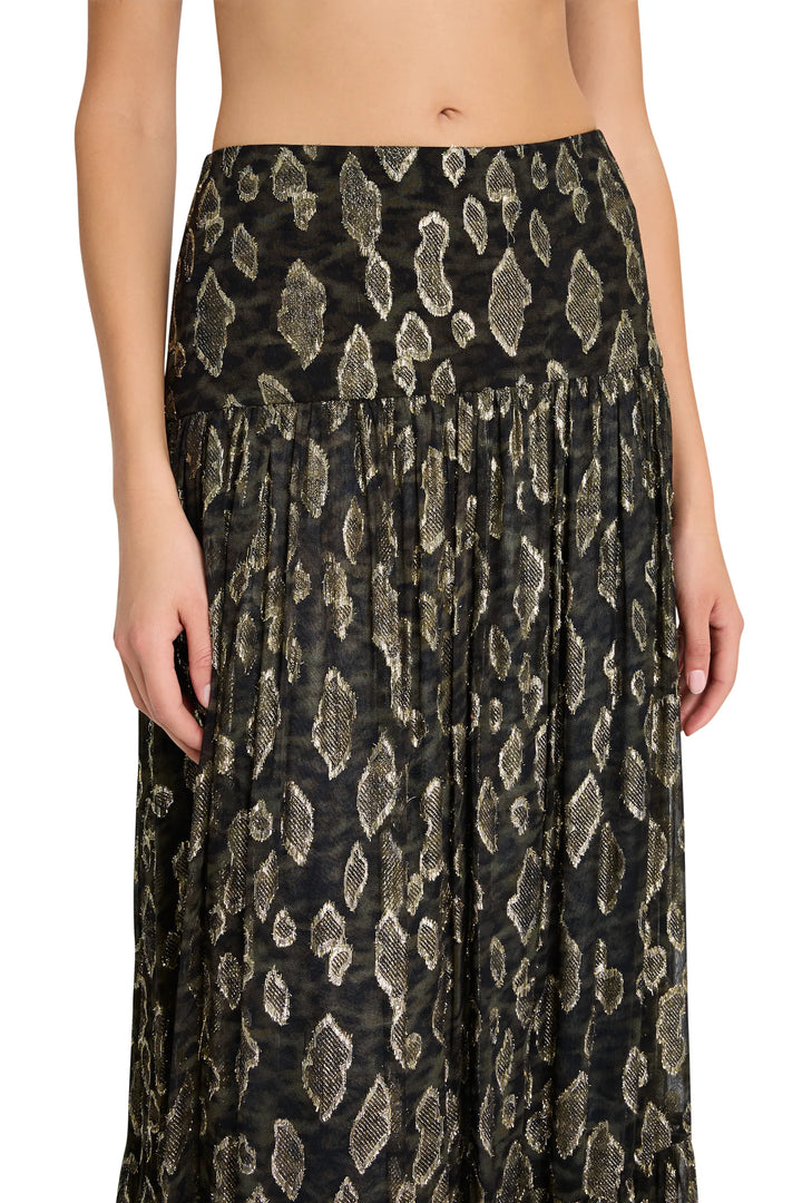 Long lurex skirt with metallic leopard print, fitted waist, slight flare silhouette; front view on model.