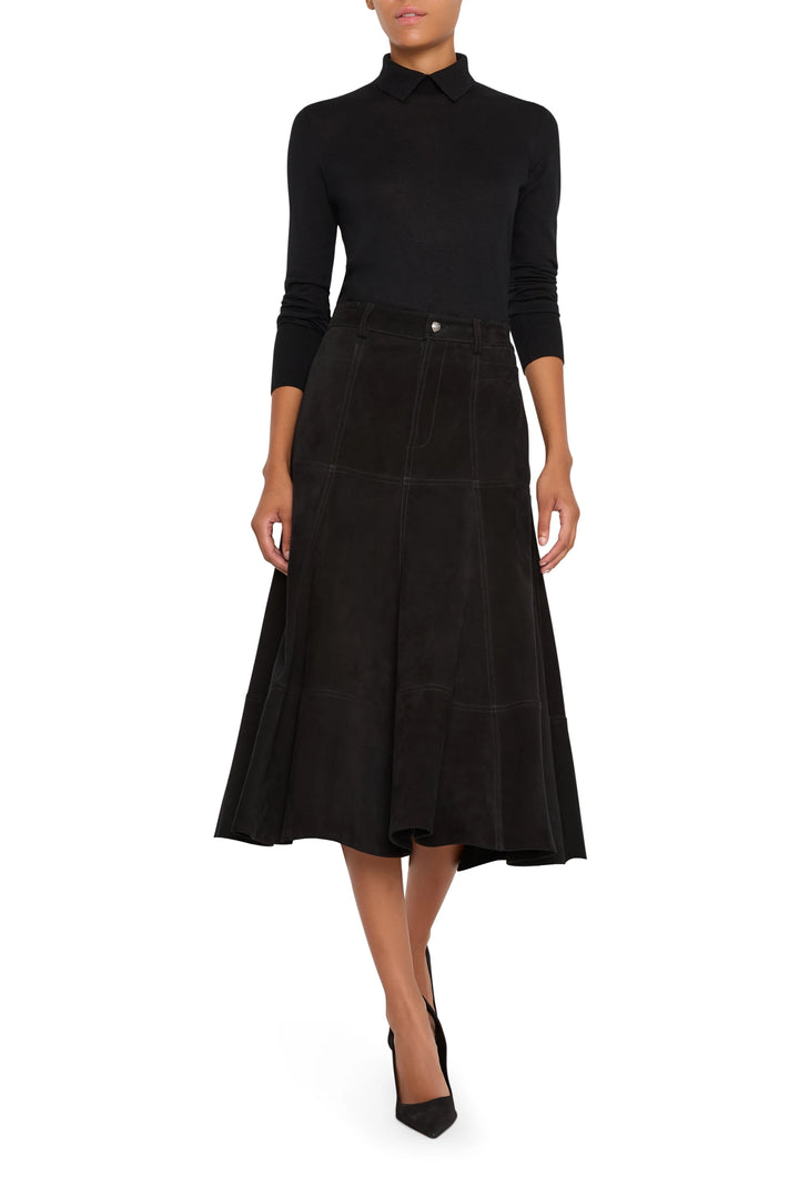 A-line suede mini skirt with panel construction and subtle topstitching, front view on white.