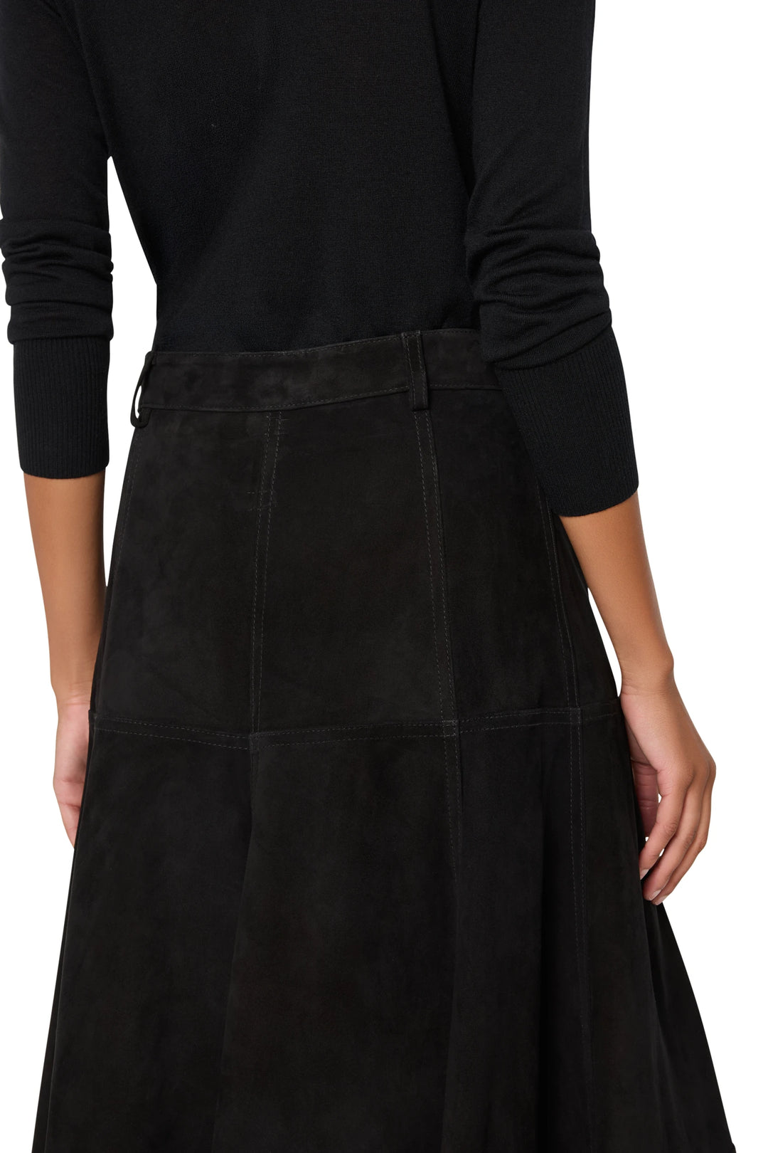 Suede skirt with straight silhouette and clean waistband, minimal detailing; back view on model.
