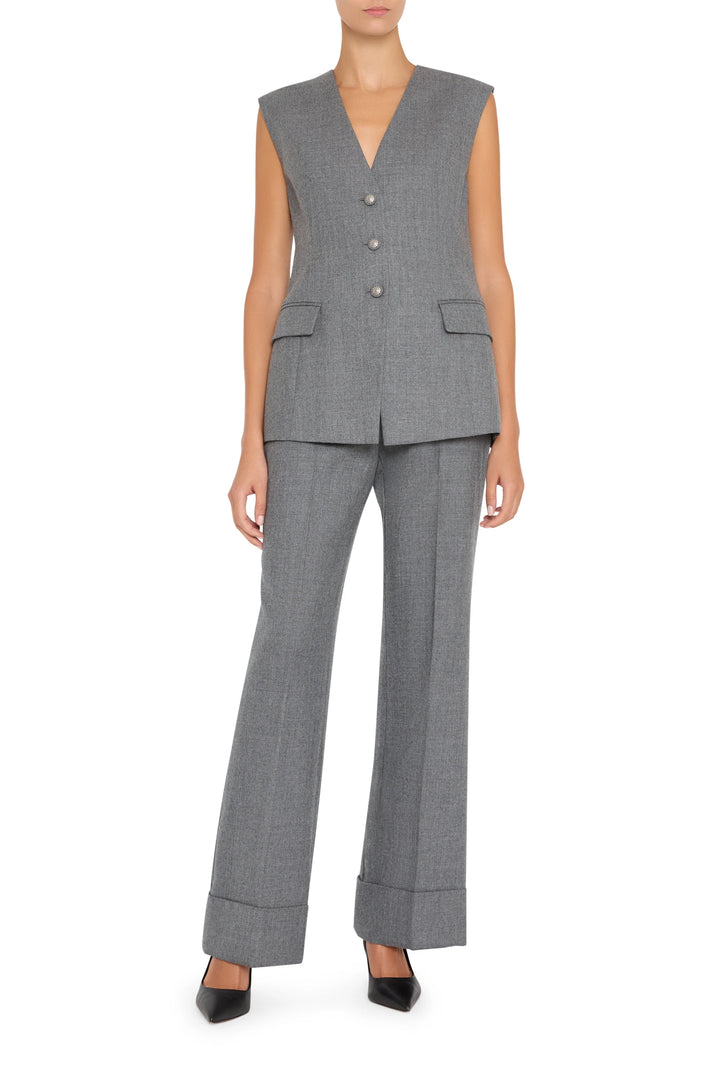 Sleeveless flannel vest with structured silhouette and classic lapel collar, front view on white.