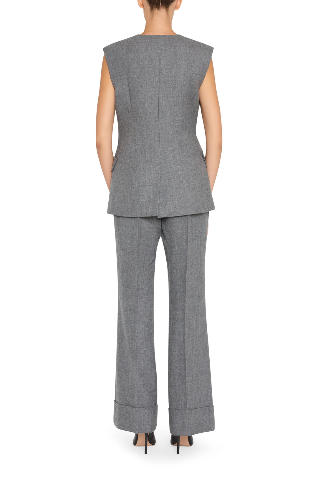 Sleeveless flannel vest with clean lines and button front, straight silhouette; back view on model.