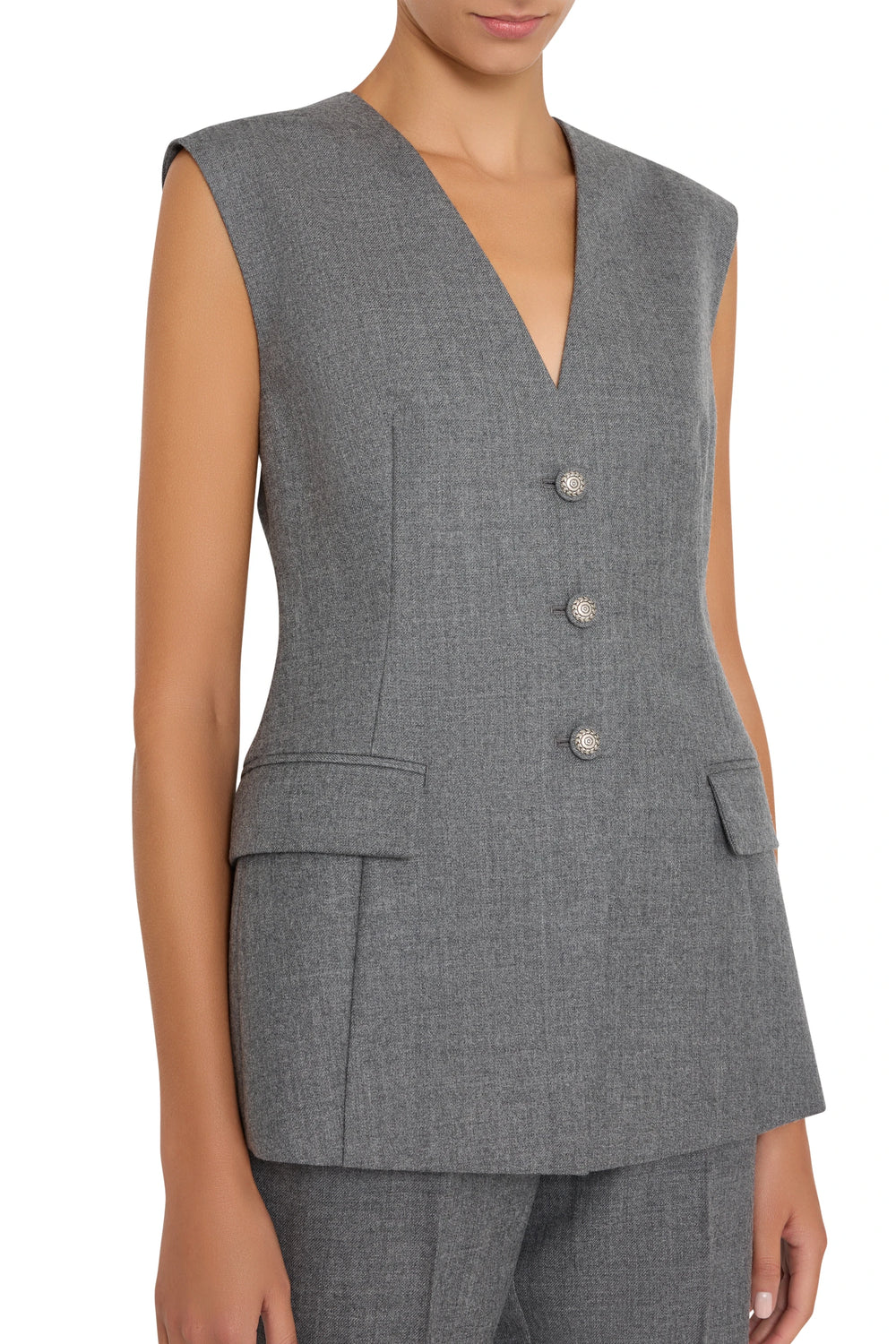 Sleeveless, tailored flannel vest with three buttons and minimal detailing. Front view on model.