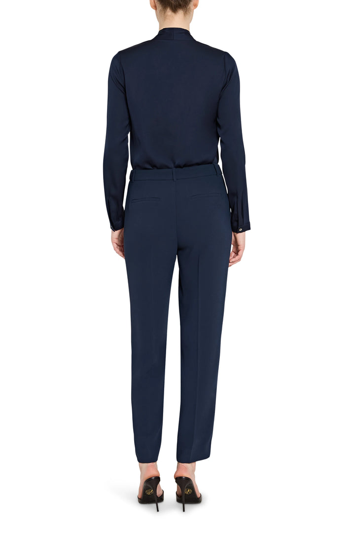 Navy blue suit with a blouse and pants on a white background