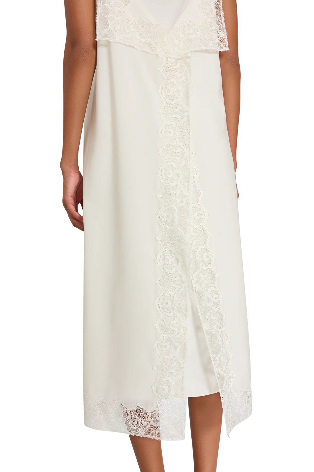 Back of the Ines Slip Dress featuring Chantilly lace trim, a vertical lace panel, and a scalloped hem, back view.