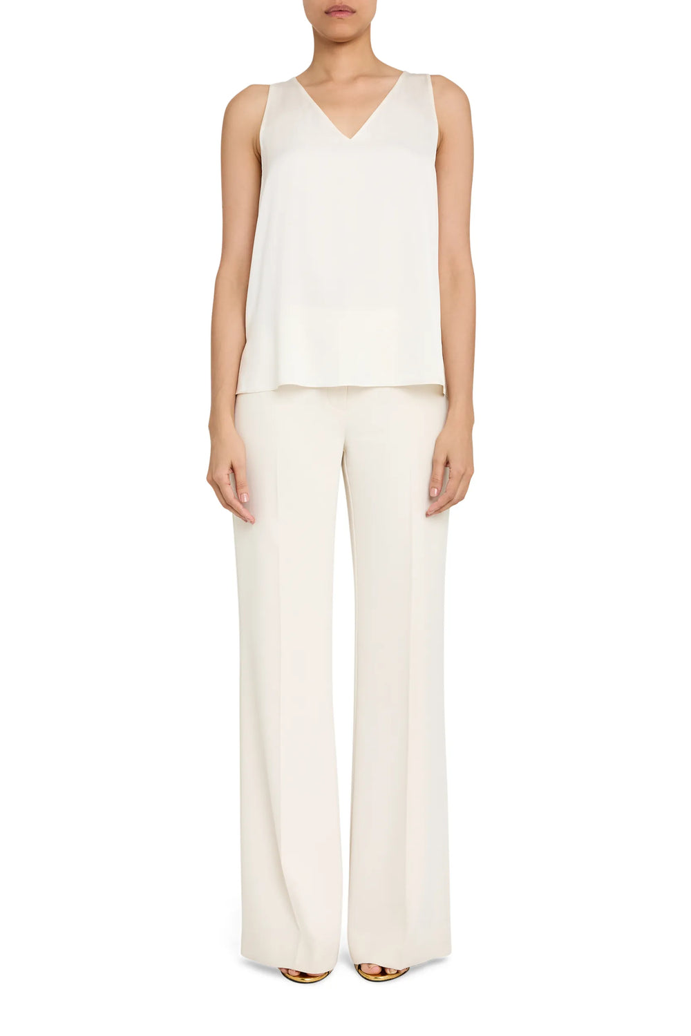 Sleeveless silk blouse with V-neckline, sailor collar, and wide-leg pants in matching fabric; front view on model.