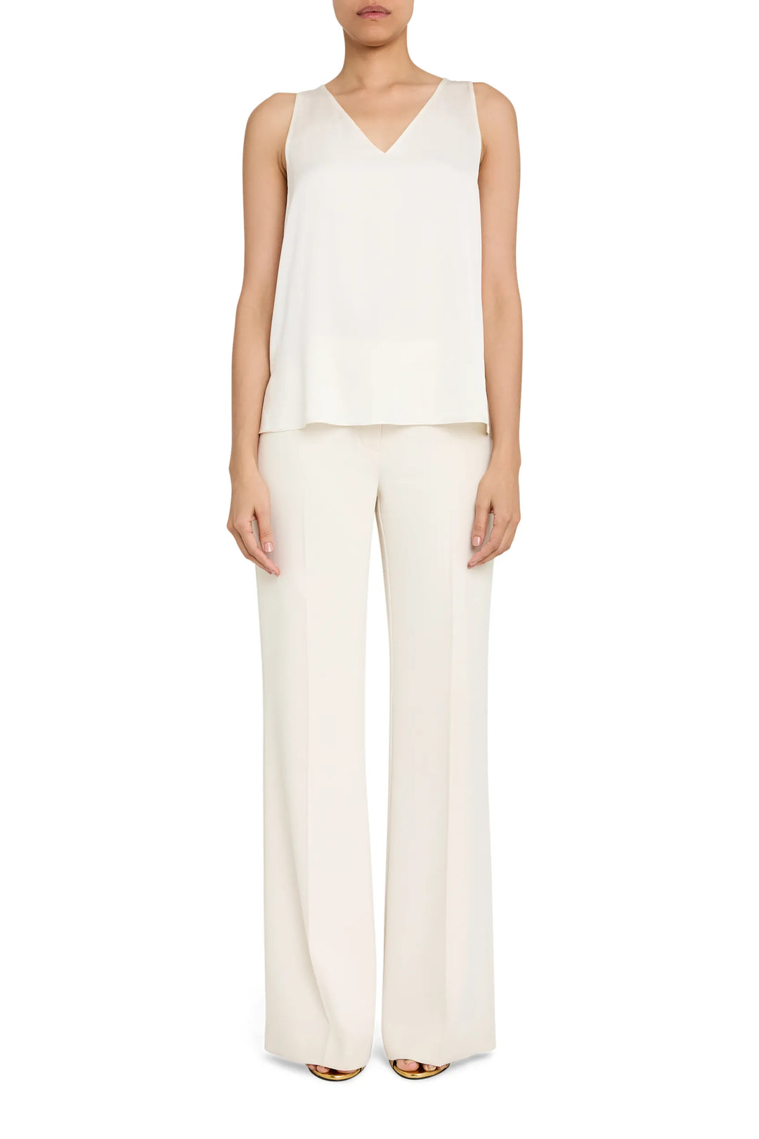 Sleeveless silk blouse with V-neckline, sailor collar, and wide-leg pants in matching fabric; front view on model.