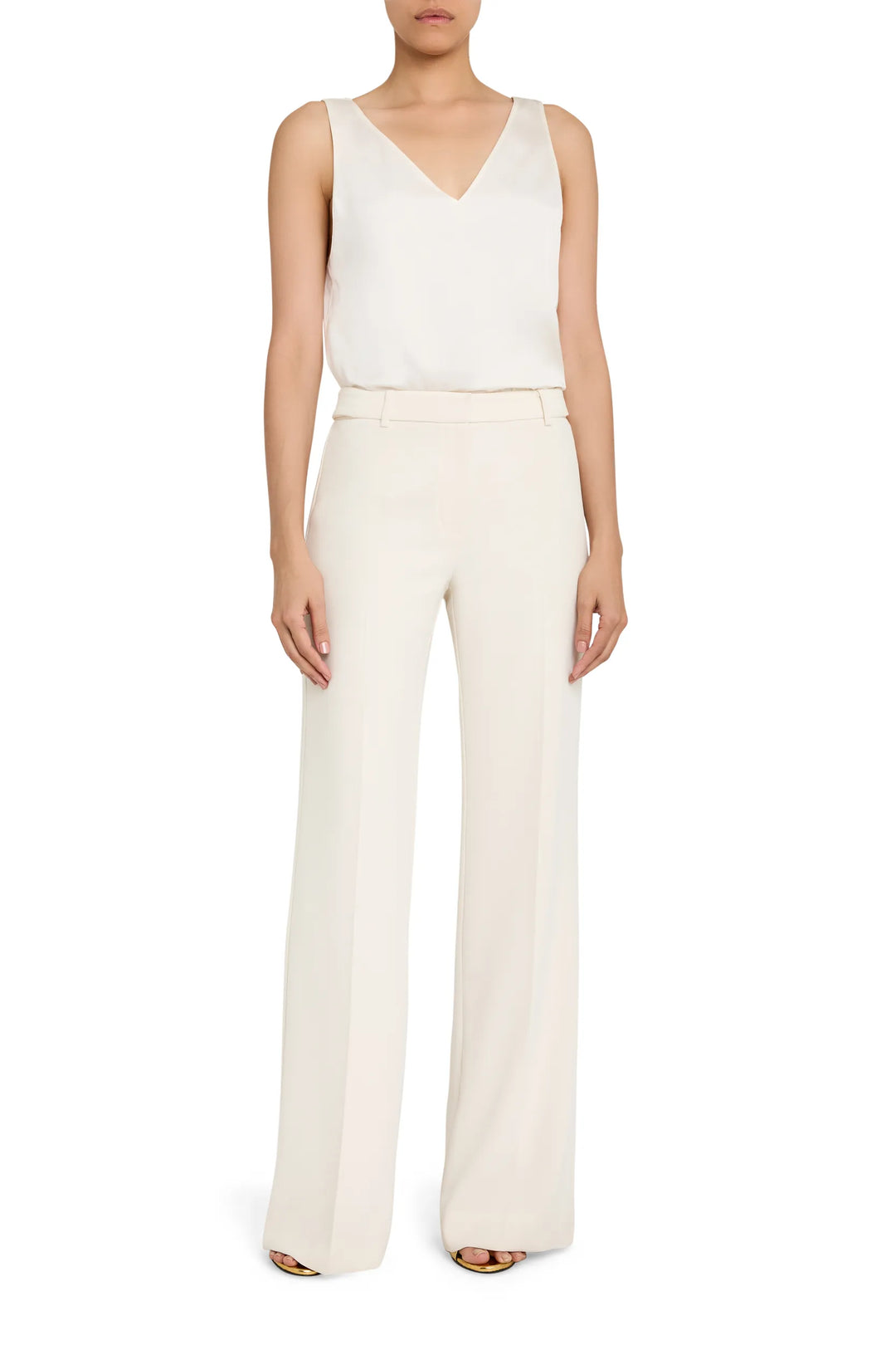 Relaxed V-neck silk blouse with clean lines and fluid drape, straight hem; front view on model.