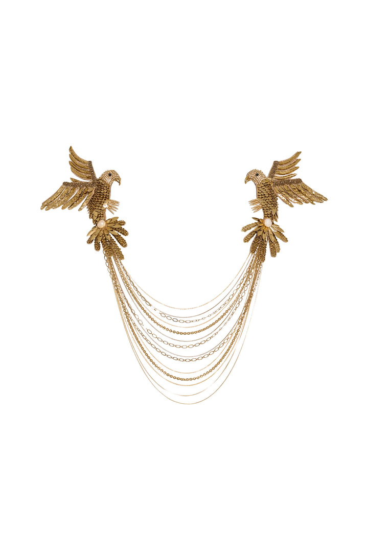 Gold bird-shaped earrings with chain details on a white background