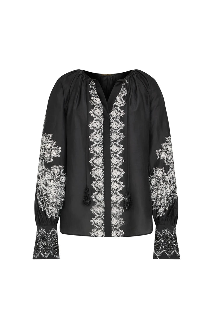 Silk cotton blouse with V-neck, handmade embroidery, tassel ties, detailed sleeves and cuffs; front view on white.