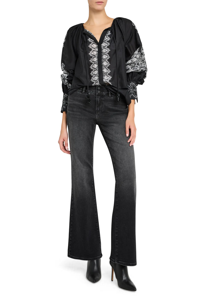 Relaxed silhouette blouse with hand-embroidered detailing and gathered neckline, cotton. Front view on white.