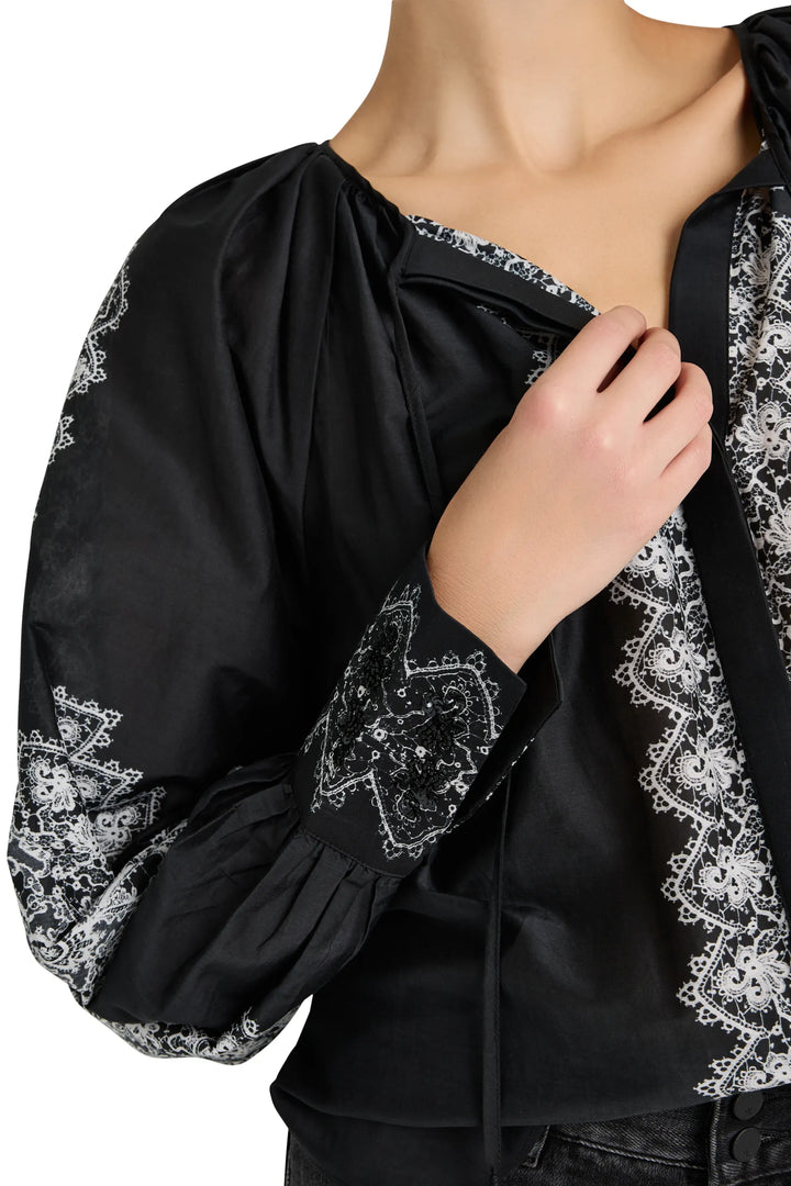 Silk cotton blouse, relaxed silhouette, handmade sleeve and front embroidery, band collar. Front view on white.