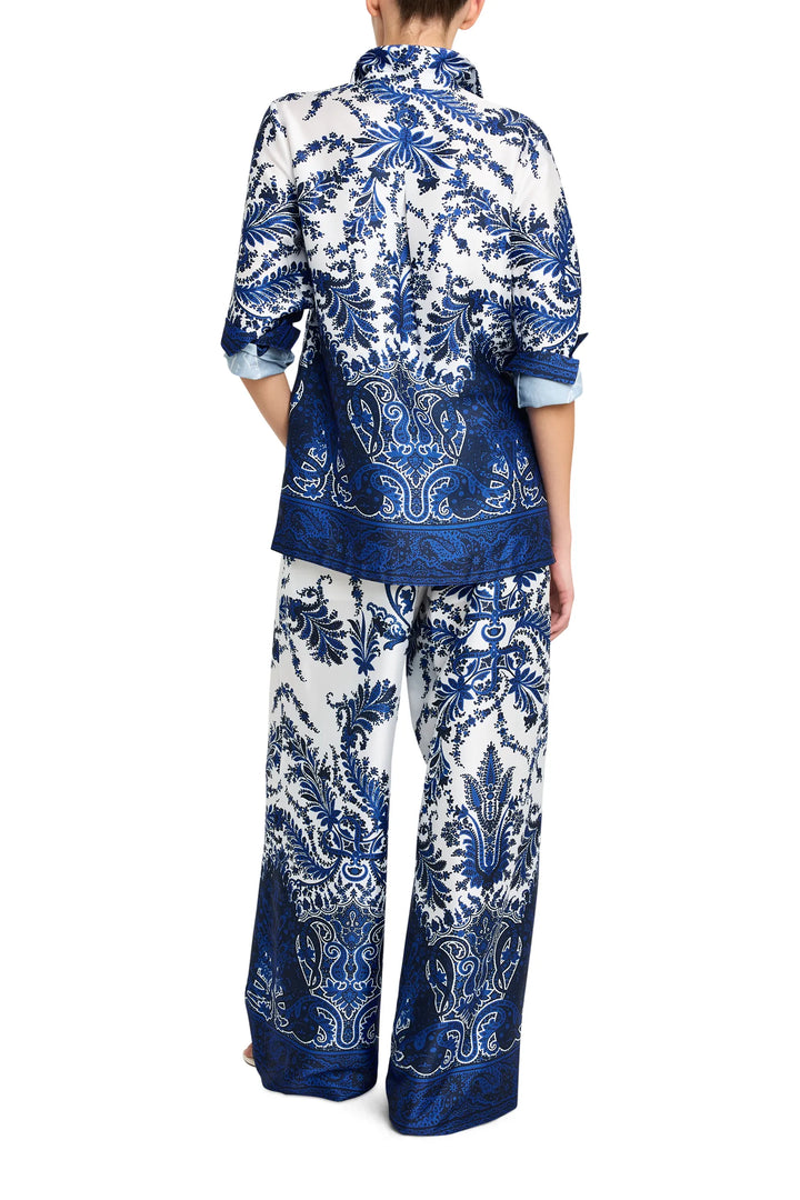 Paisley print blouse with long sleeves, relaxed fit, lightweight fabric. Back view on model.