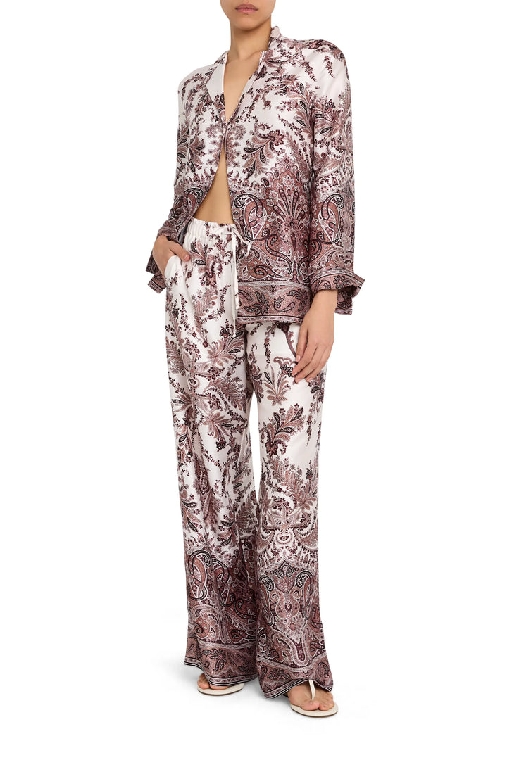 Relaxed-fit blouse in printed twill with button front, point collar, and long sleeves; front view on model.