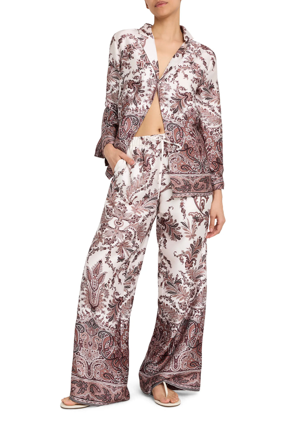 Relaxed-fit blouse with button front, spread collar, and long sleeves in printed twill; front view on model.