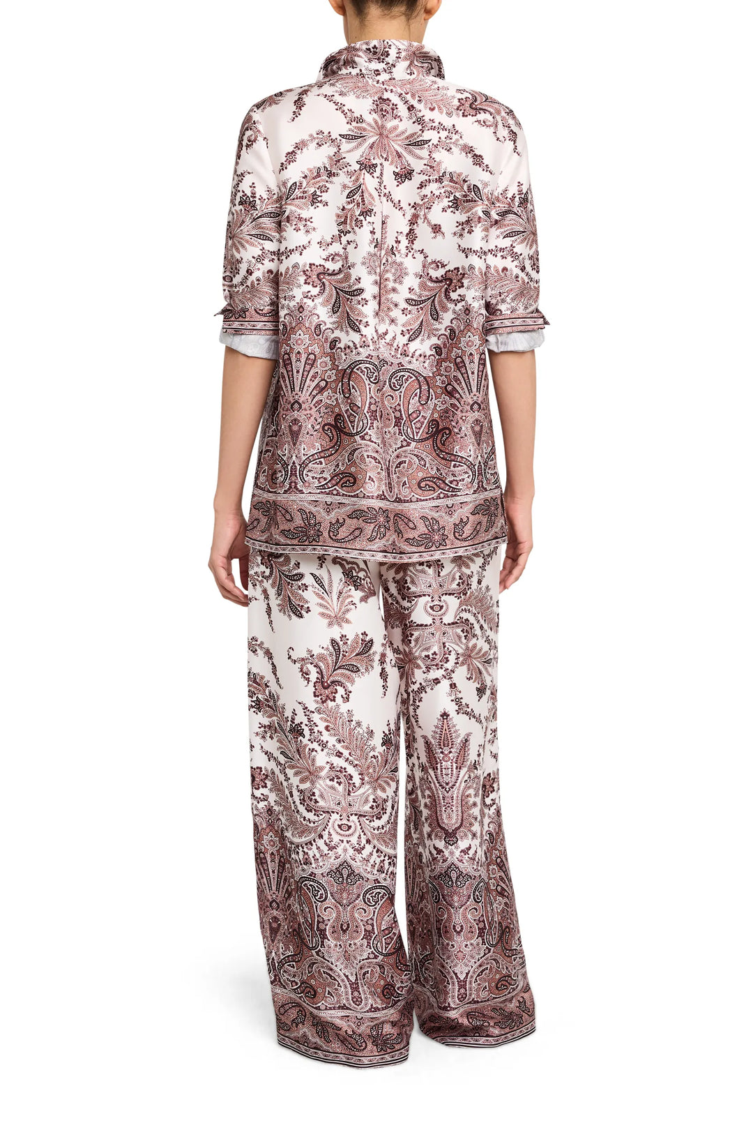 Relaxed silhouette blouse in printed twill with back yoke and soft drape, back view on model.