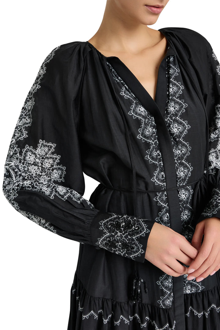 Maxi dress with relaxed silhouette, hand-embroidered front, sleeves, cuffs; tonal embroidery. Front view on model.