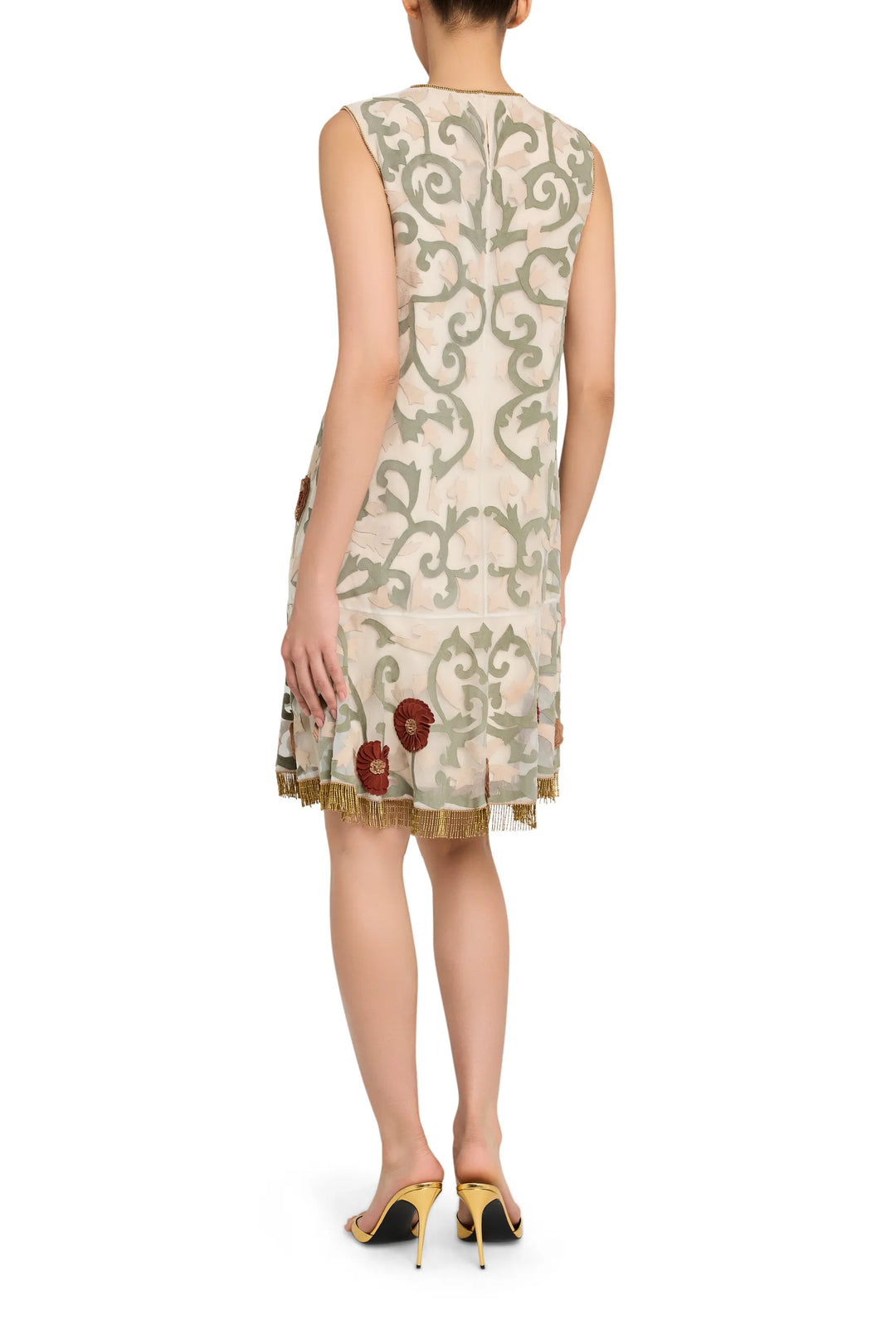 Mini dress in organza with sleeveless cut, back fringe trim and floral leather appliqué embroidery; back view on model.