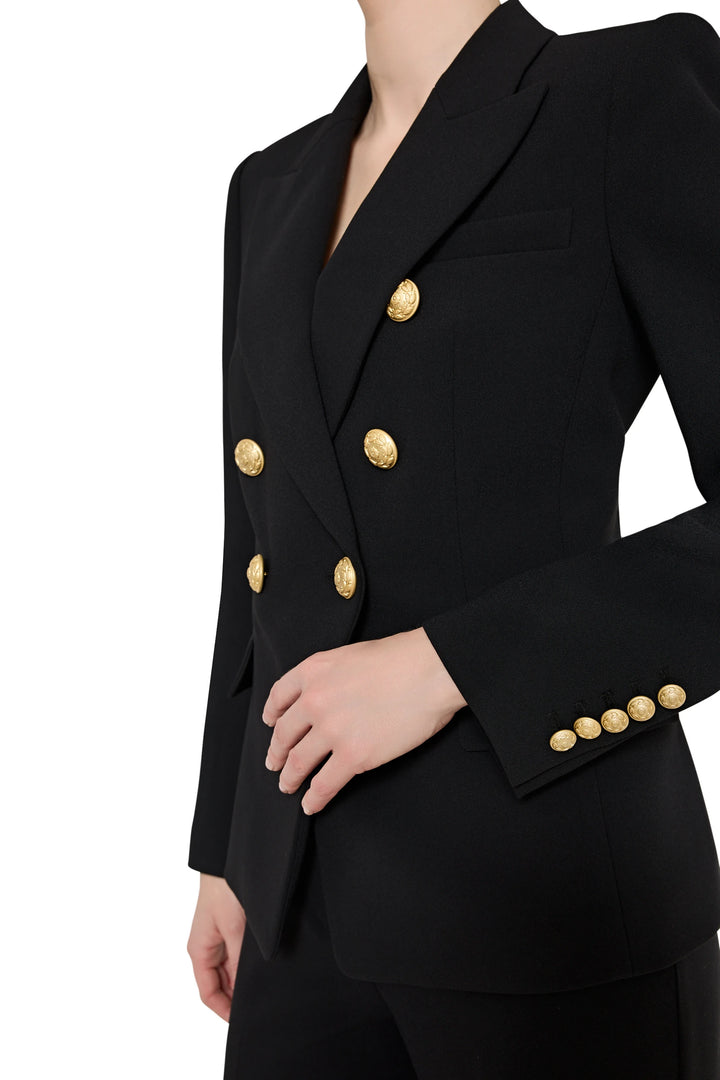 Black blazer with gold buttons on a white background