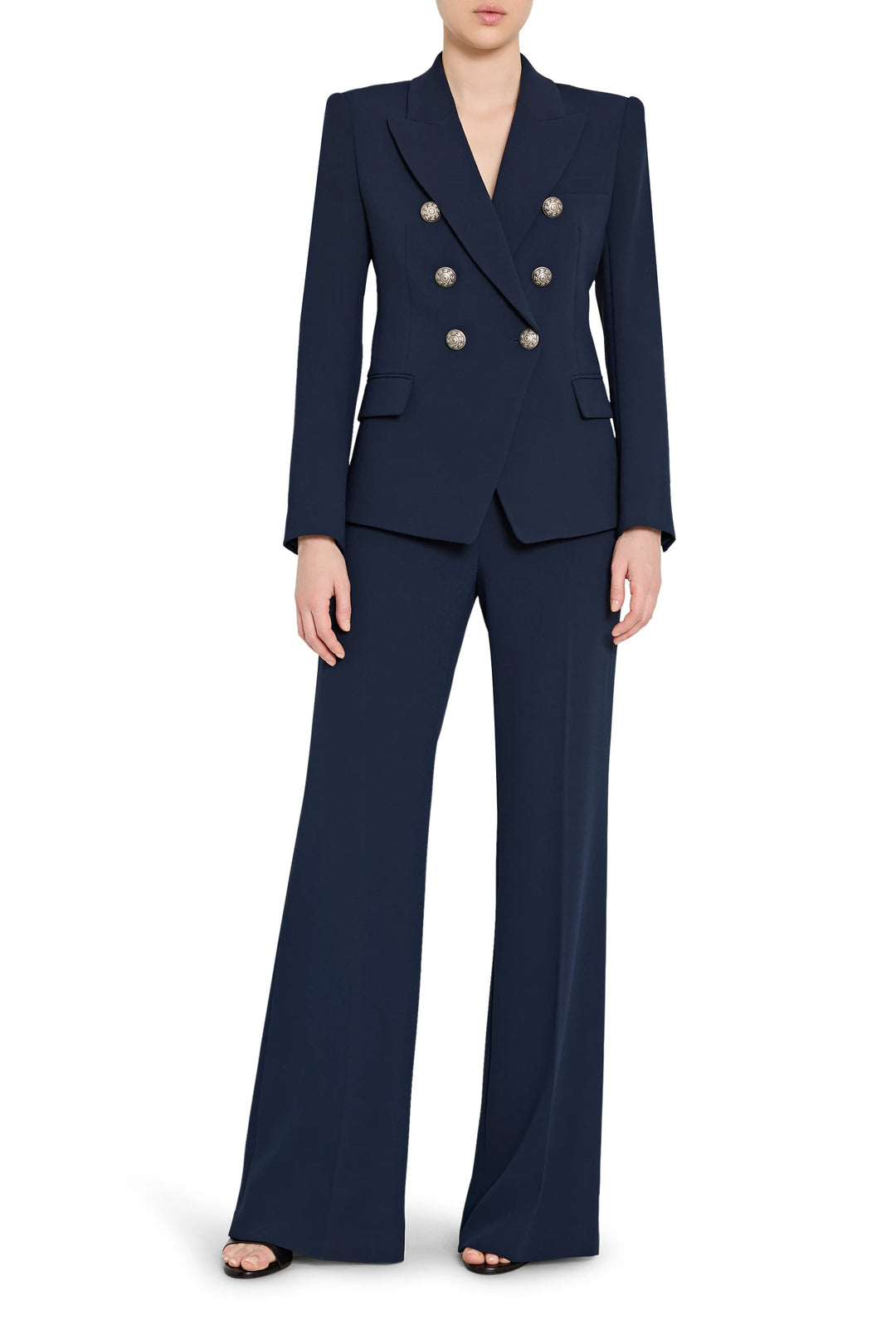 Navy blue suit with gold buttons on a white background