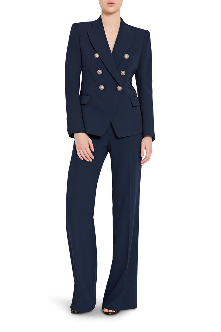 Navy blue suit with gold buttons on a white background