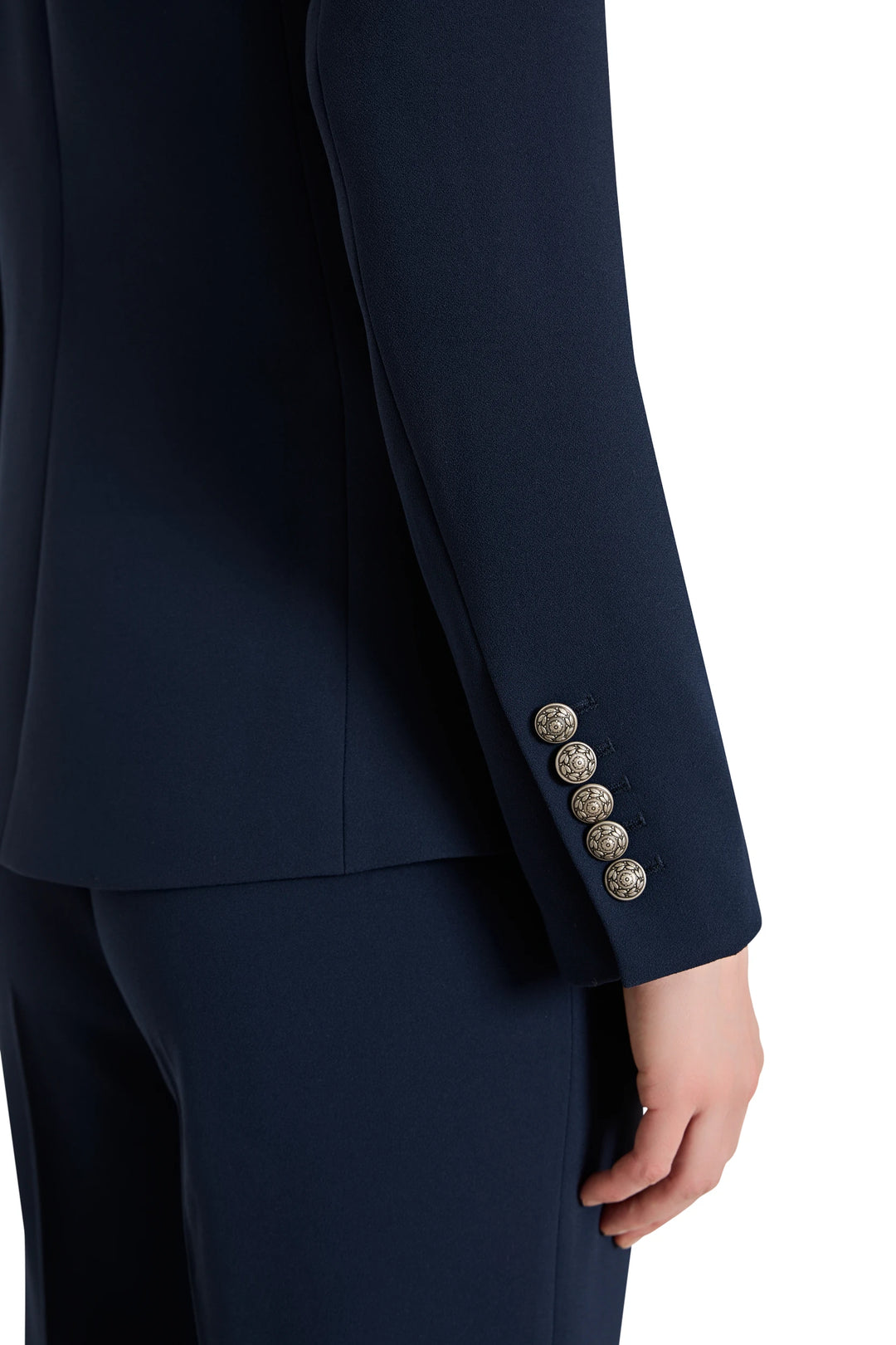 Navy blue suit with decorative buttons on a white background