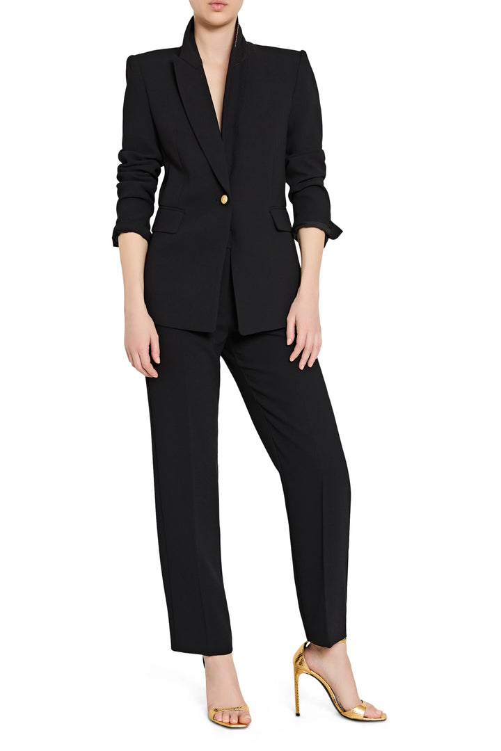 Black suit with a blazer and pants on a white background