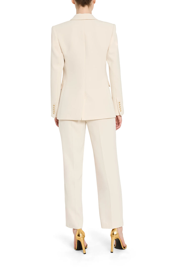 Beige suit worn by a person on a white background