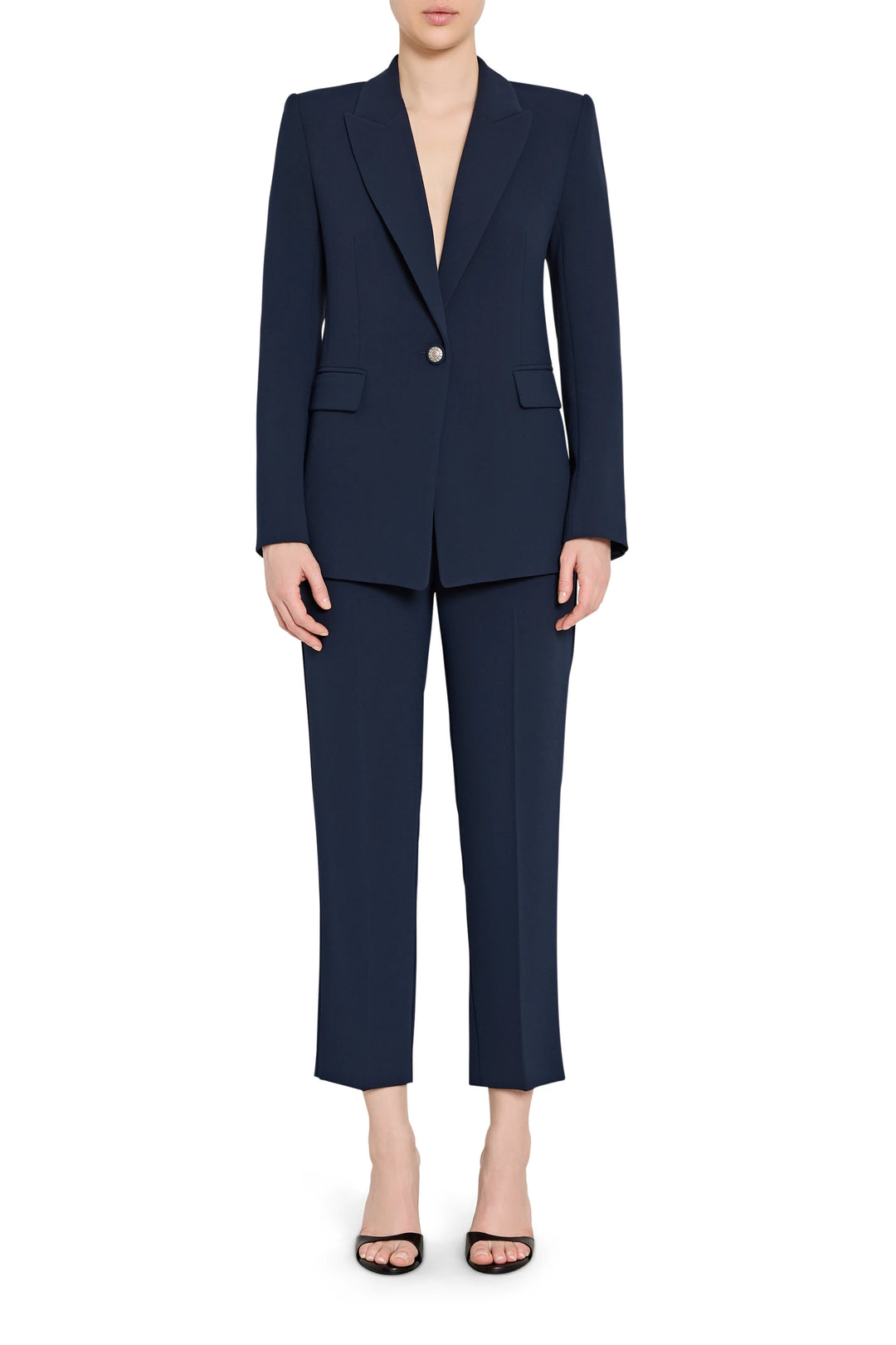 Navy blue suit with a blazer and pants on a white background