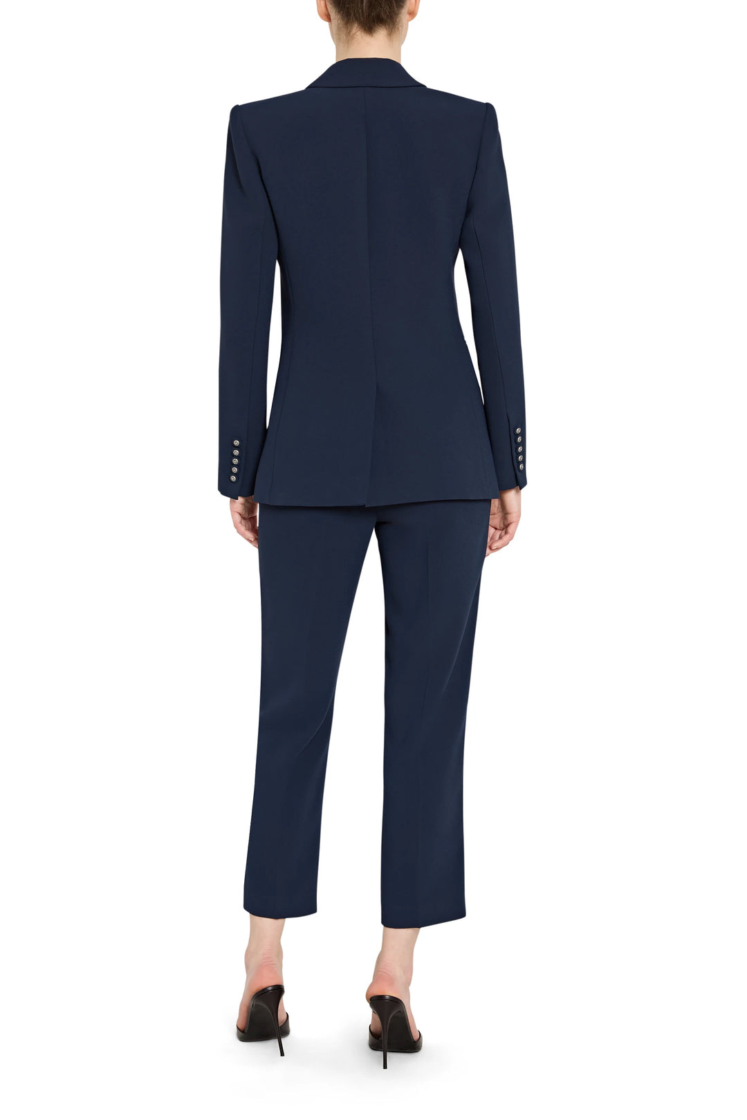 Navy suit with cropped pants on a white background