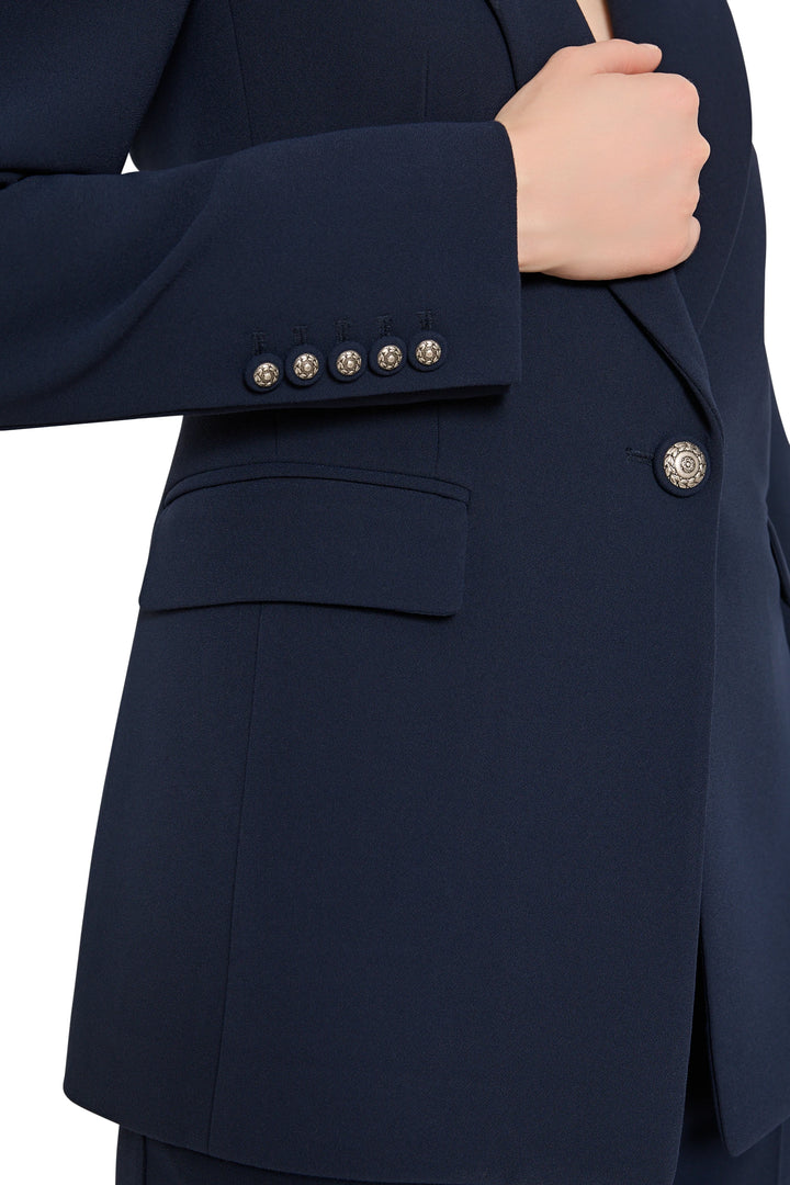 Navy blue suit jacket with silver buttons on a white background