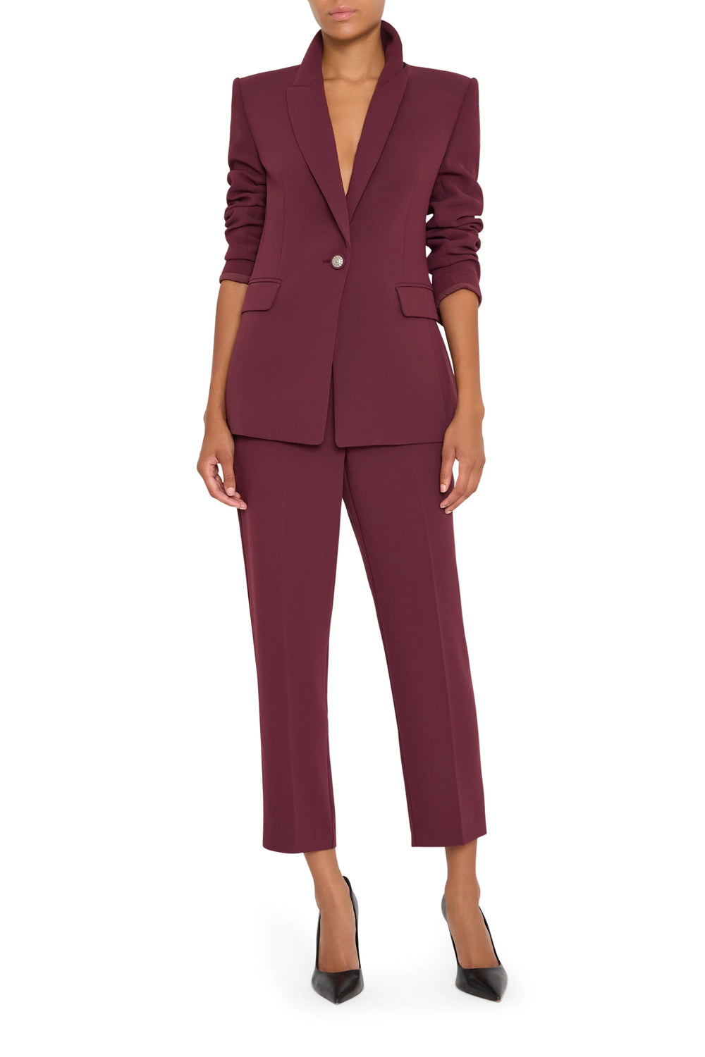 Crepe blazer with elongated silhouette, tailored construction, clean lines. Front view on model.