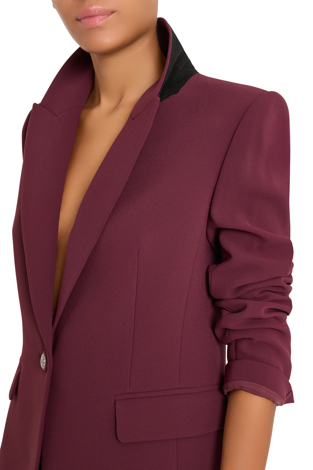 Tailored crepe blazer with ruched sleeves, artisan buttons, and contrast collar. Front view on model.