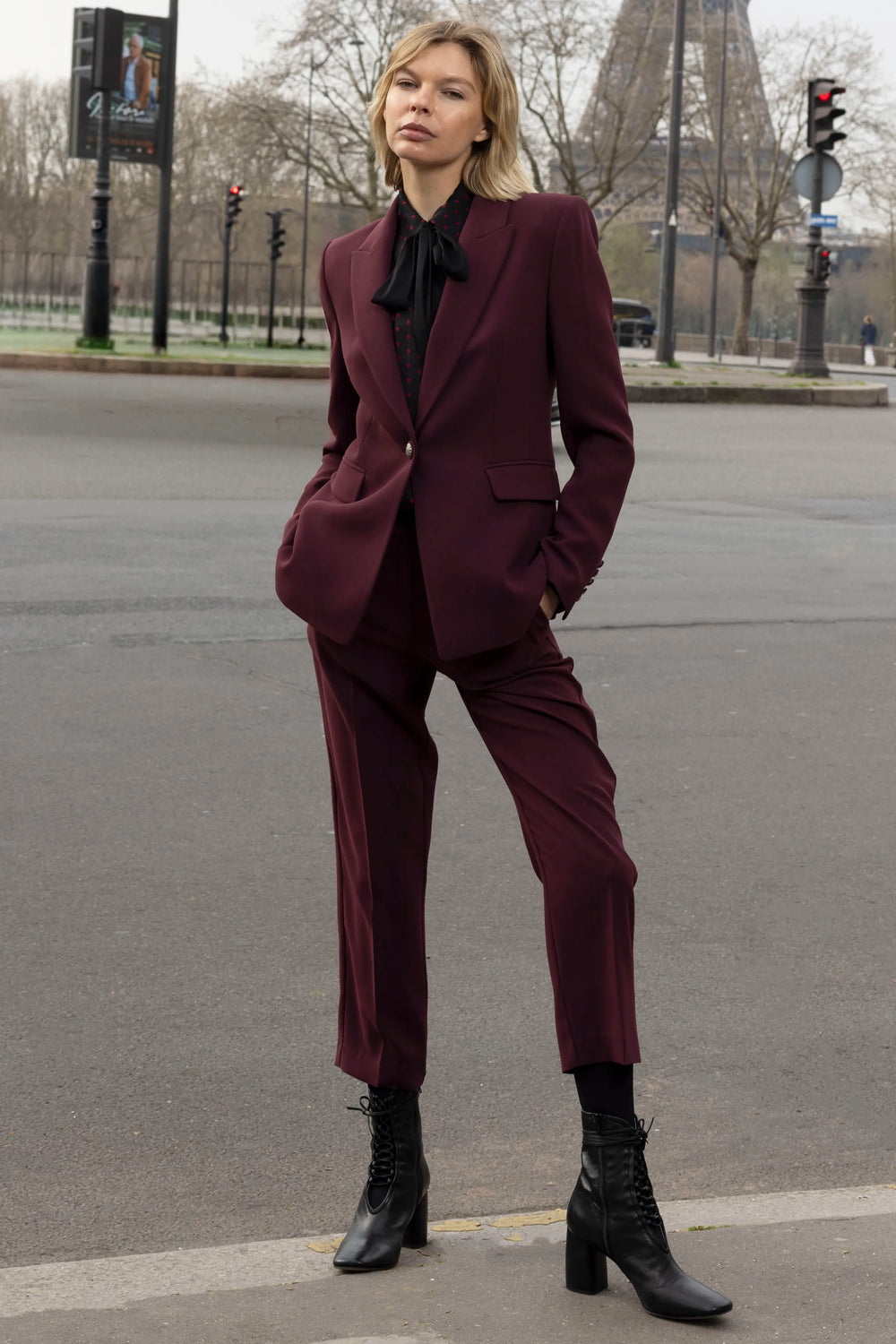 Single-button crepe blazer with tailored silhouette and structured shoulders, front view on model.