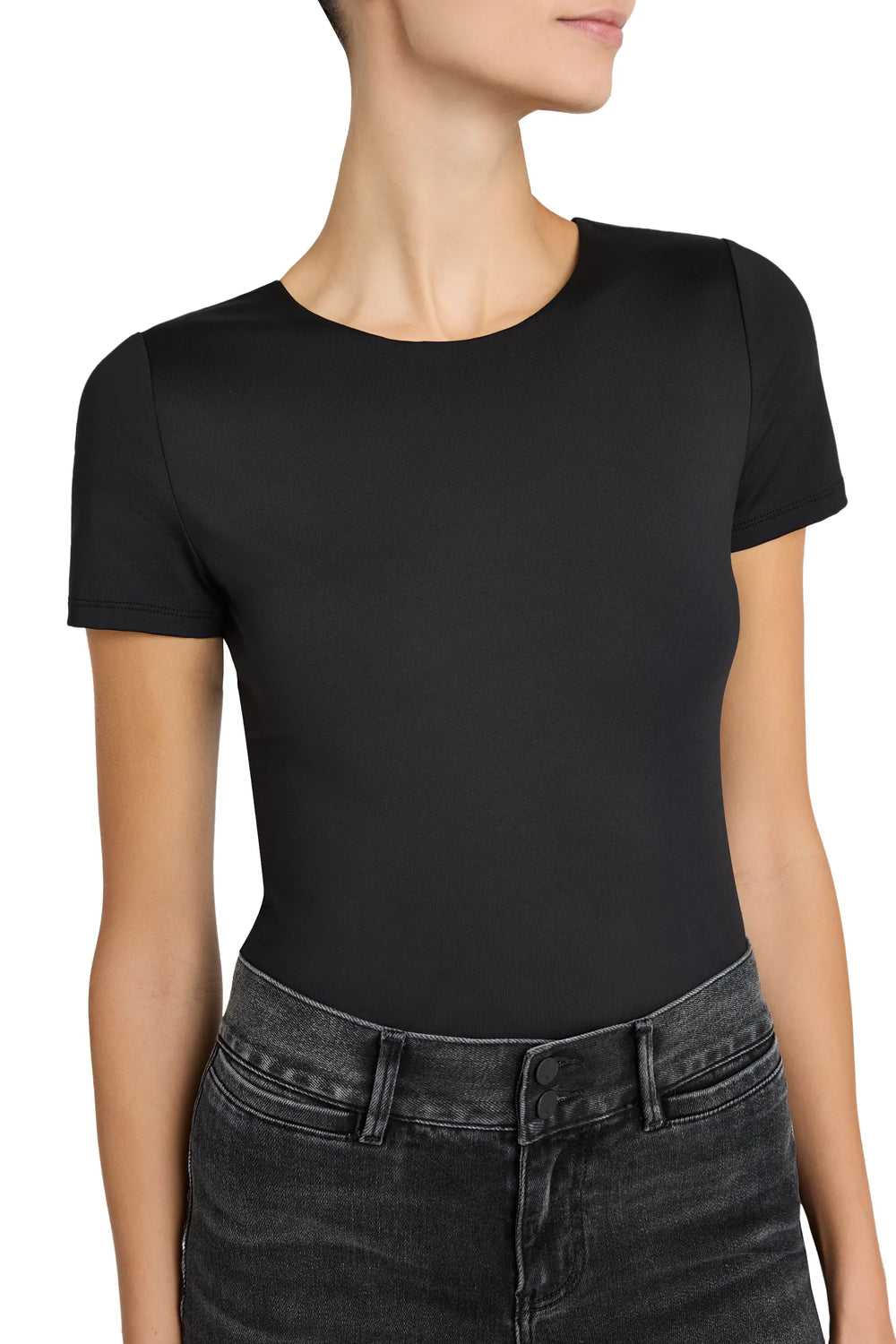 Short-sleeve knit top with a fitted silhouette and fine ribbed texture, crew neckline. Side view on model.