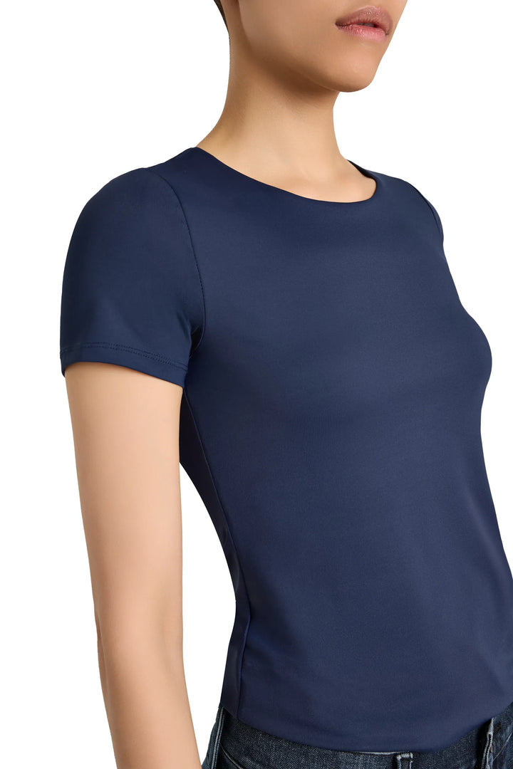 Fitted short-sleeve tee with crew neck, fine knit texture, clean hem; front view on white.