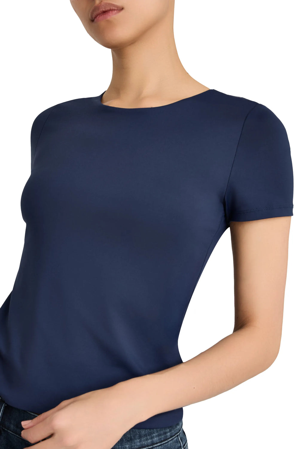 Fitted short-sleeve knit T-shirt with round neck, clean silhouette; front view on model.