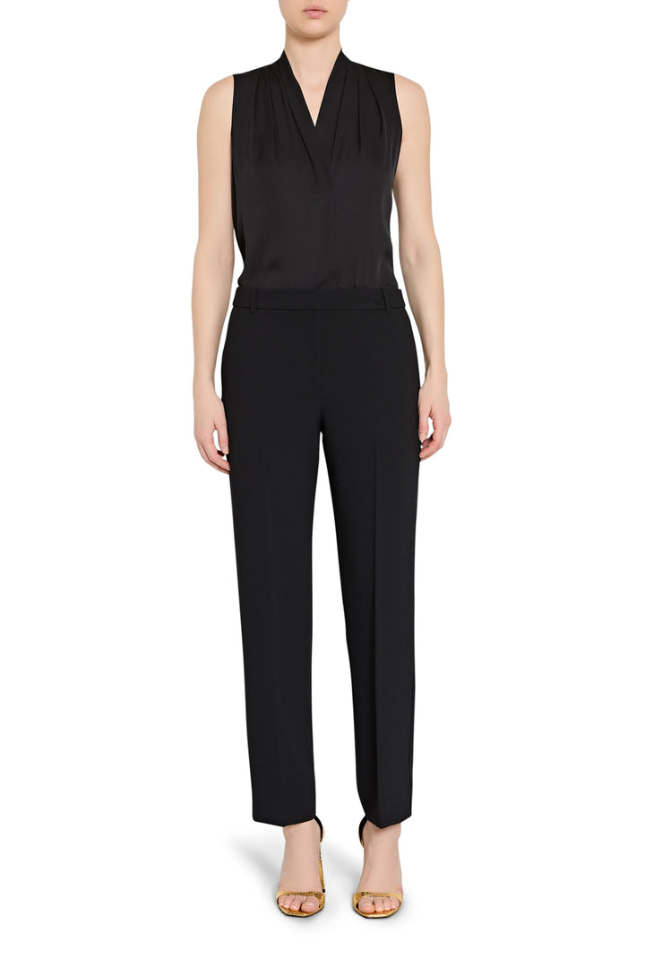 Black sleeveless top and pants set on a white background