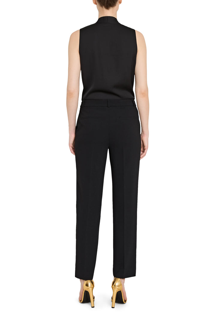 Black sleeveless top and pants set on a white background