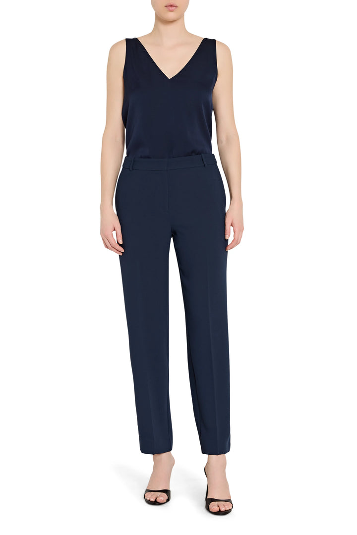Navy blue sleeveless top and pants set on a white background