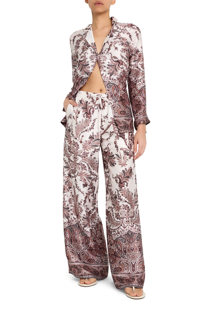 Wide-leg twill pants with paisley print, elastic waist, fluid silhouette. Front view on model.