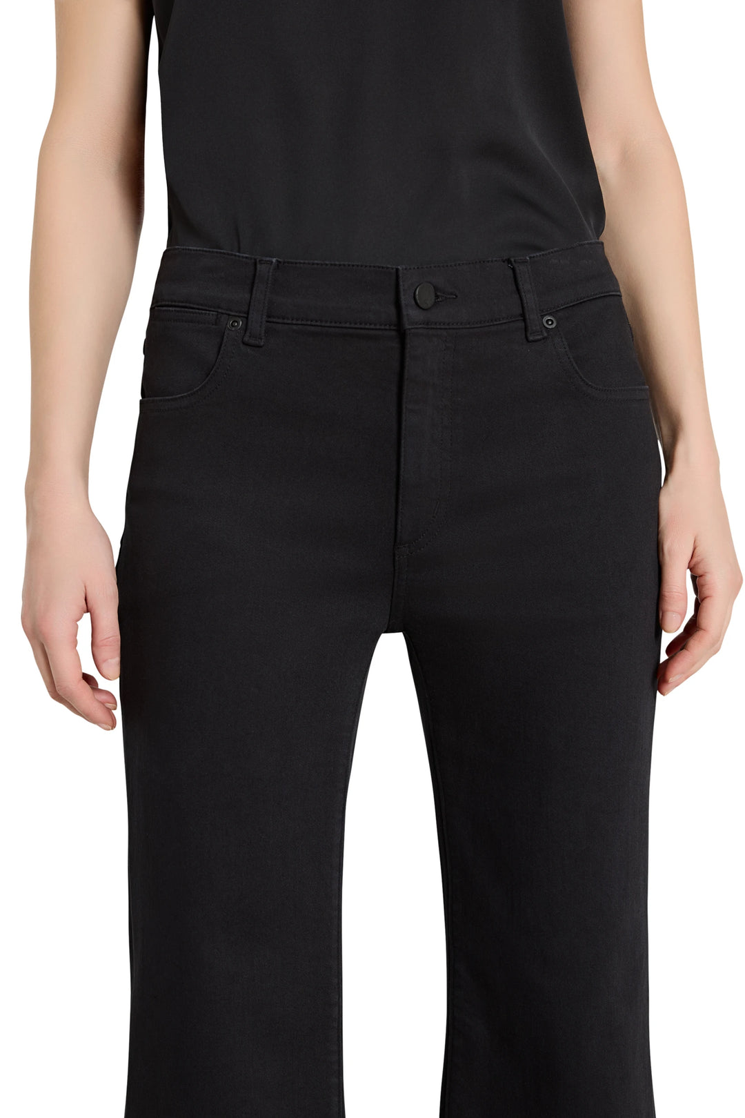 Person wearing black pants on a white background