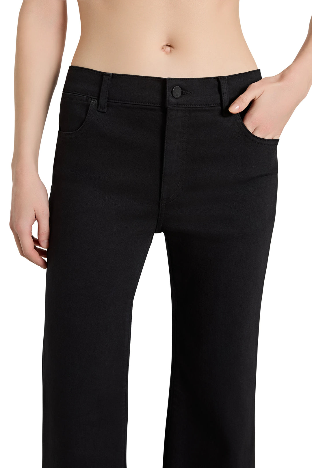 Black pants worn by a person on a white background