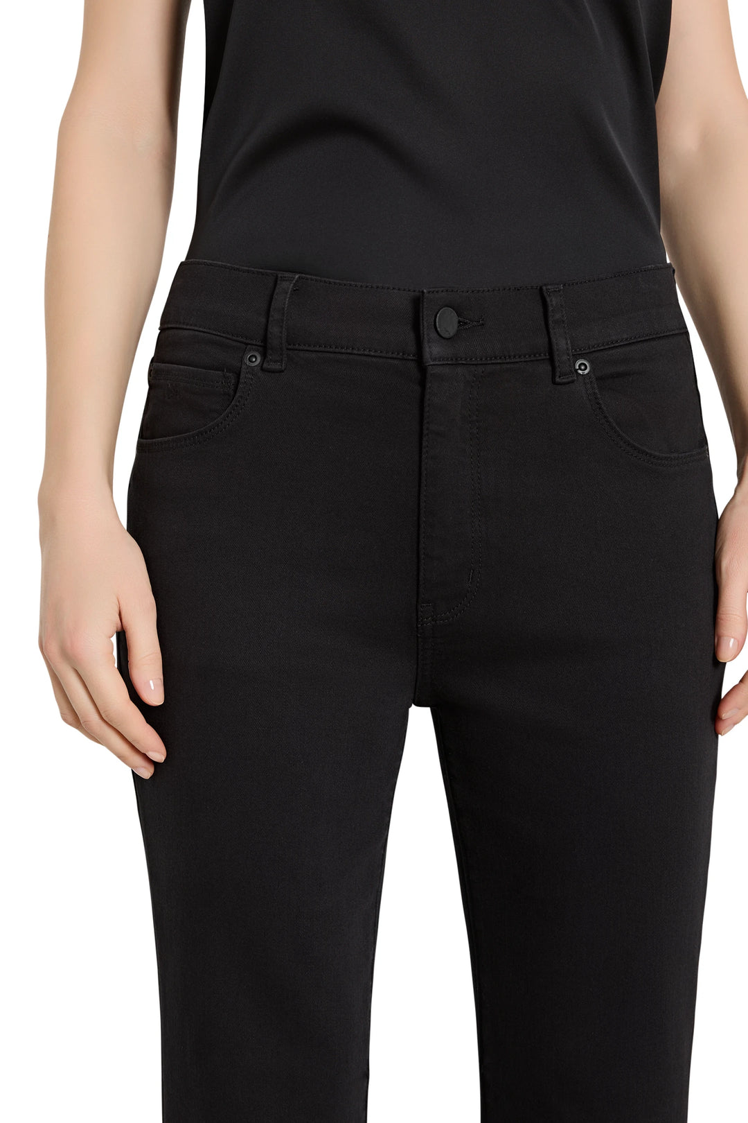 Person wearing black pants on a white background