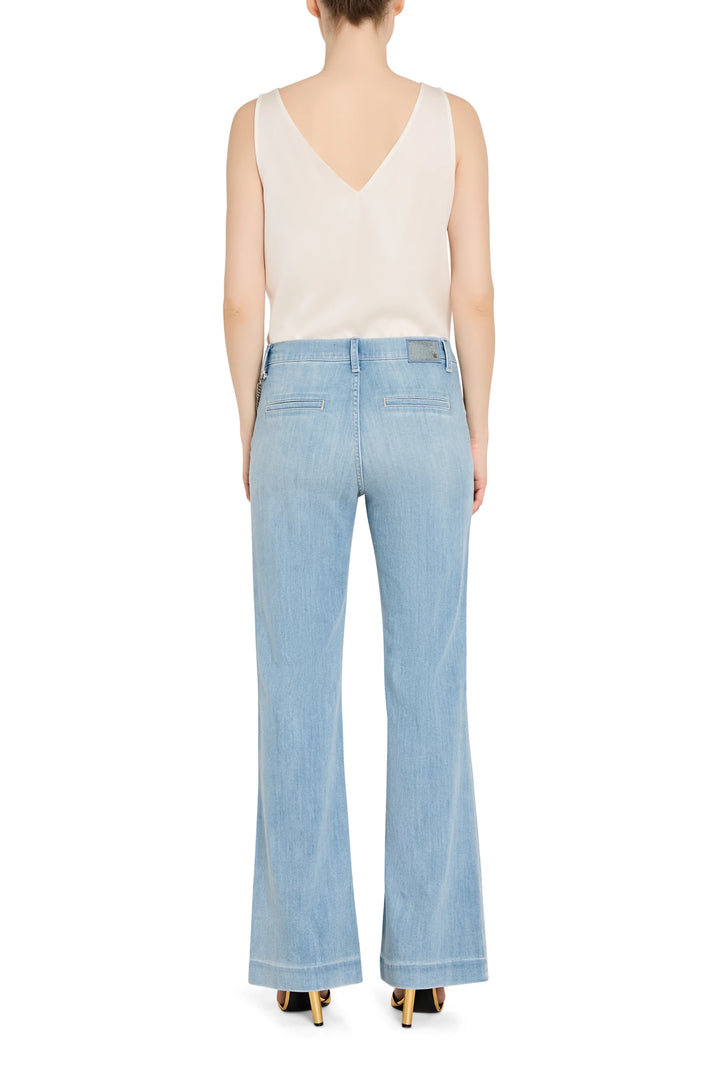 Light blue jeans worn by a person on a white background