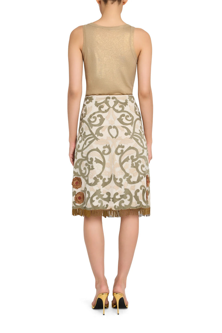 Organza midi skirt with appliqué and fringe trim, fluid silhouette, construction details visible, back view on model.
